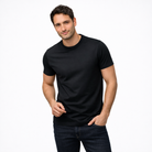 Man wearing a black t-shirt and jeans on a white background